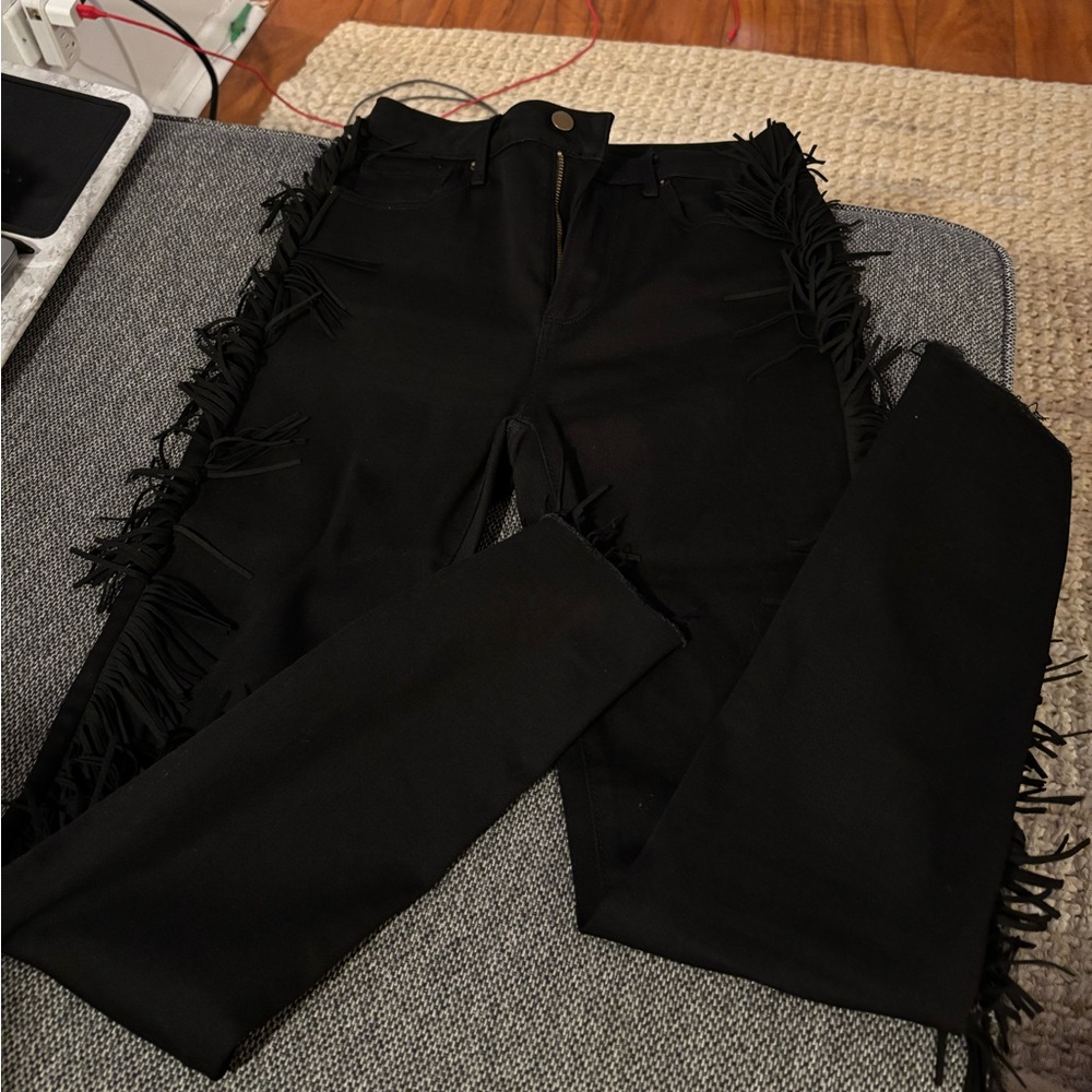 black skinny jeans with fringe down each leg. Only worn once. Size 25, Aqua.